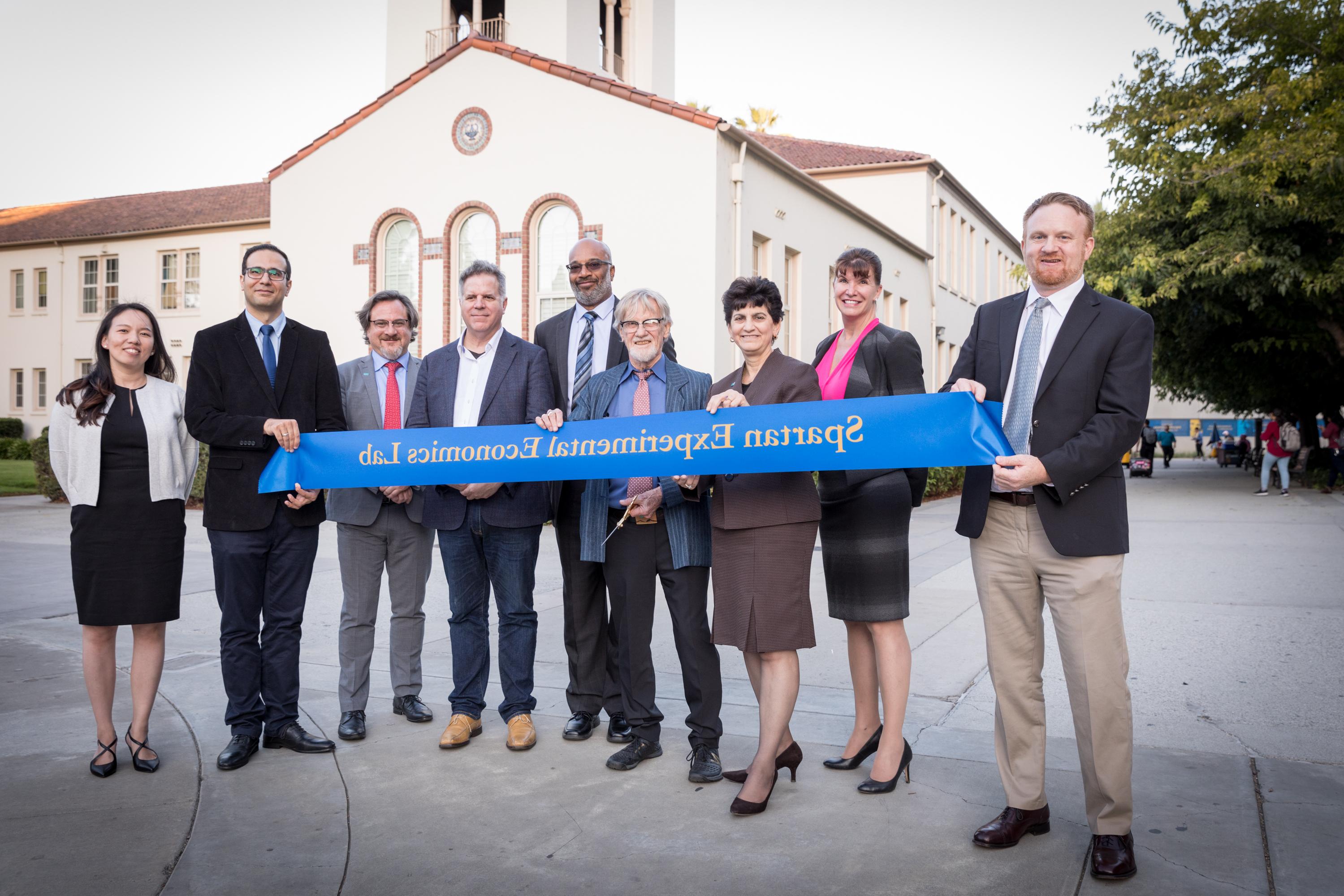 Faculty holding a SEEL banner on the day the lab opened.